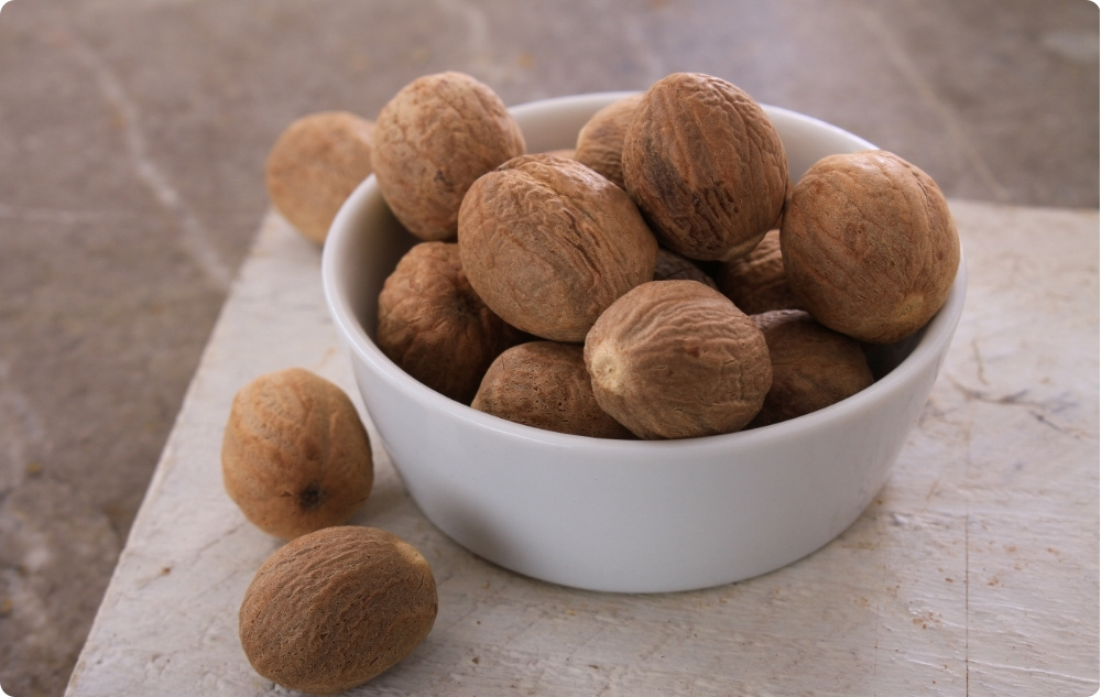 What does Nutmeg Essential oil help with?